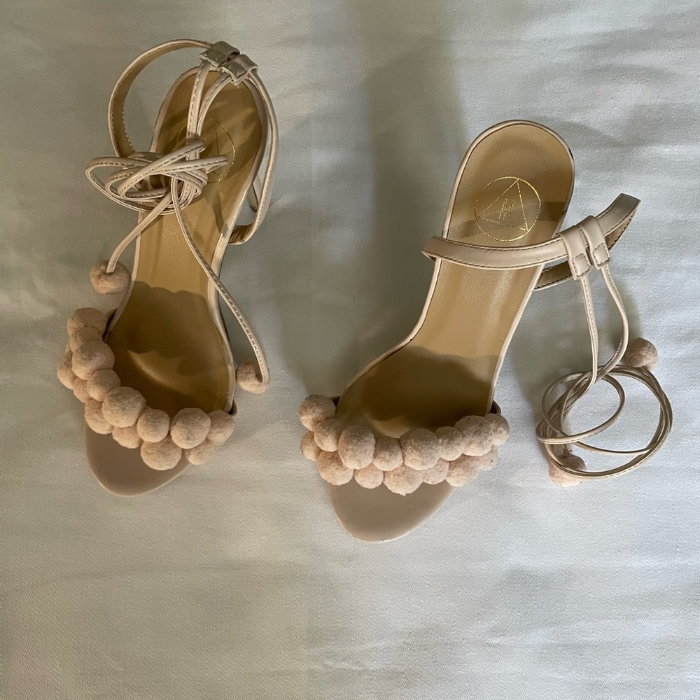 Size 6/39 cream/ pink, high heel shoes with long straps that tie with Pom Poms.
